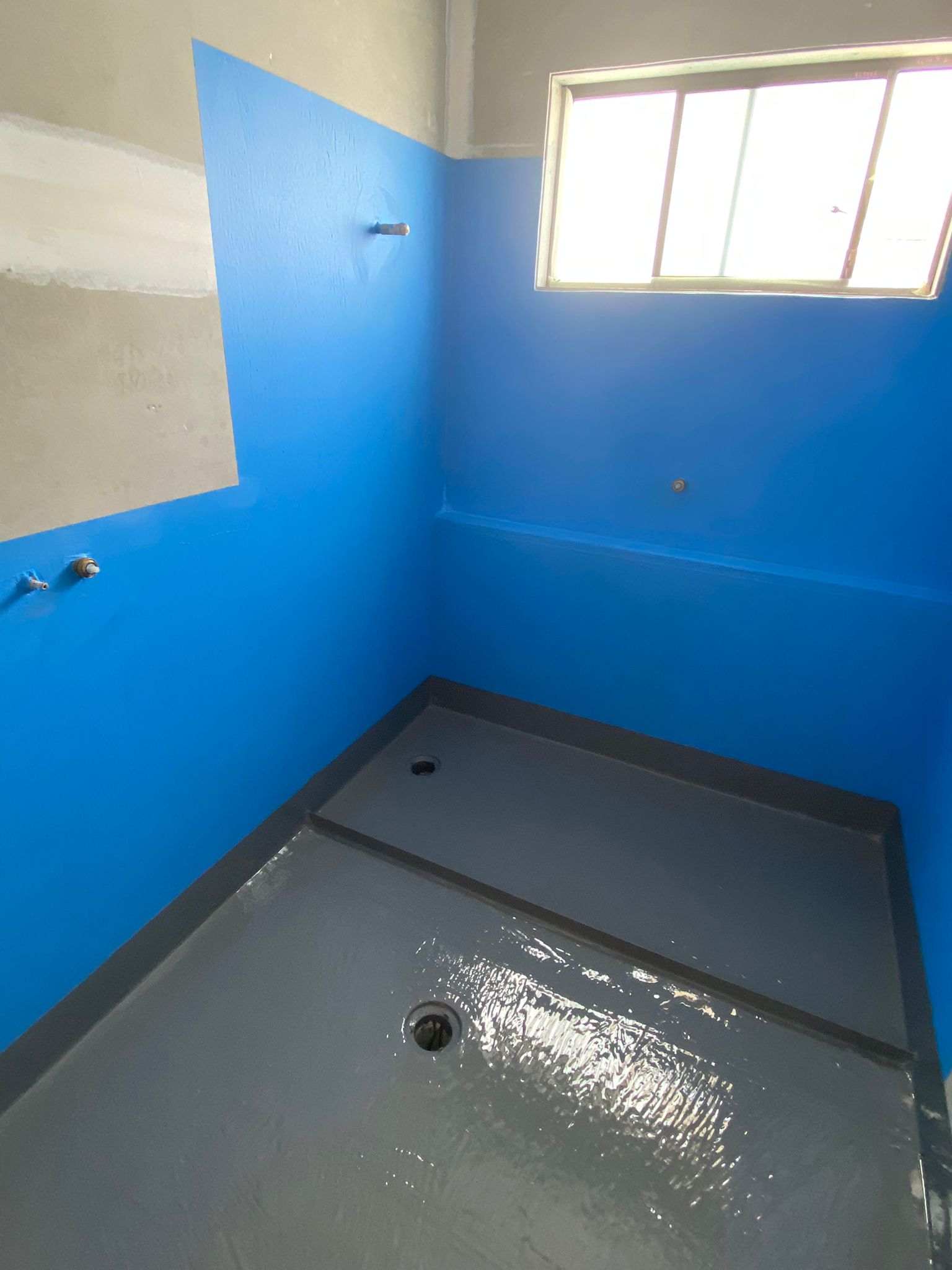 Blue waterproofing membrane application - wall junction - Sydney Choice Waterproofing